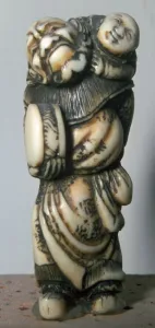 Japanese Netsuke of a Chinese dancer and child, 18th century. Artist: Masahira Japanese Netsuke of a Chinese dancer and child, 18th century. Artist: Masahira