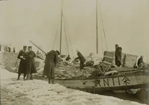 Japanese officers directing the unloading of supplies, Chemulpo, c1904. Creator: Robert Lee Dunn