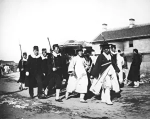Escorting Prints: Japanese official with an escort of soldiers, Korea, c1900