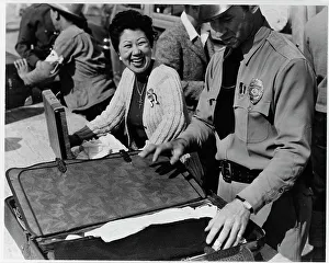 Suitcase Prints: Japanese relocation, California, 1942. Creator: Dorothea Lange