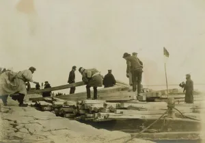 Japanese removing timbers from lighters at Chemulpo for erection of runways, c1904. Creator: Robert Lee Dunn