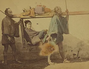 Japanese woman in a sedan, being carried by two men, 1865-1875. Creator: Unknown