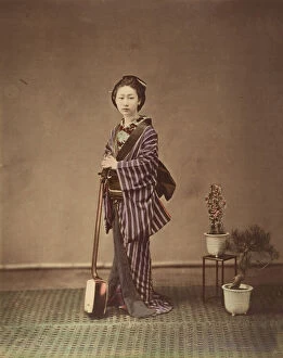 Potted Plants Gallery: [Japanese Woman in Traditional Dress Posing with Instrument], 1870s. Creator: Unknown