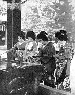 Images Dated 13th November 2007: Japanese women washing their hands prior to entering a temple, 1936.Artist: Sport & General