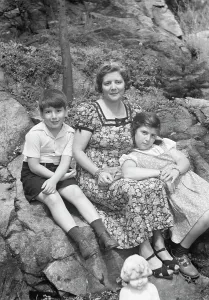 Group Portraits Prints: Javits, Benjamin, Mrs. and children, seated oudoors, ca. 1935. Creator: Arnold Genthe