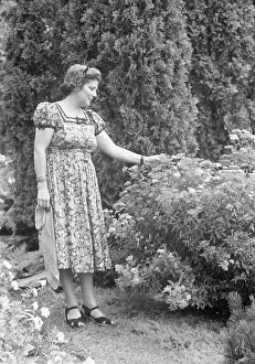 Javits, Benjamin, Mrs. standing outdoors, ca. 1925. Creator: Arnold Genthe