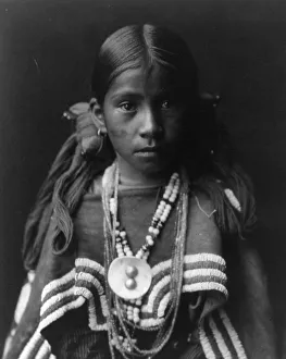 Apache Prints: Jicarilla girl in feast dress, c1905. Creator: Edward Sheriff Curtis