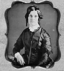 Joannette Clark Benjamin, three-quarter length portrait of a woman, facing front, seated, c1840-1860 Creator: Unknown