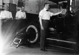 John Drennen inspecting meter, 1913. Creator: Bain News Service