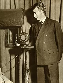 Broadcasting Collection: John Logie Baird watching the first play to be televised, 14 July 1930, (1935). Creator: Unknown