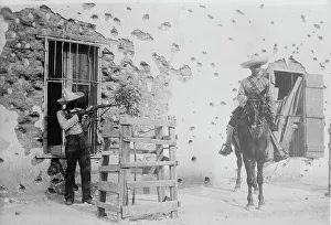 Mud Brick Prints: Juarez, Adobe house riddled, between c1910 and c1915. Creator: Bain News Service