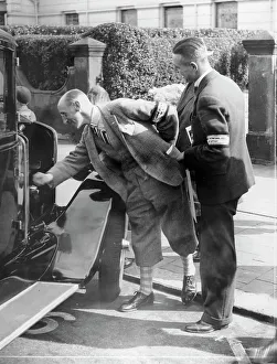 Inspecting Prints: A judge inspecting a car at the Southport Rally, 1928