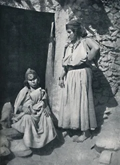 Kabyle women at the door of their dwelling near the Mediterranean coast, Algeria, 1912.. Artist: Kuhn Kabyle women at the door of their dwelling near the Mediterranean coast, Algeria, 1912.. Artist: Kuhn