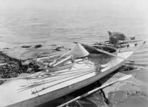Gear Prints: Kaiak with seal hunting equipment, Nunivak, c1929. Creator: Edward Sheriff Curtis