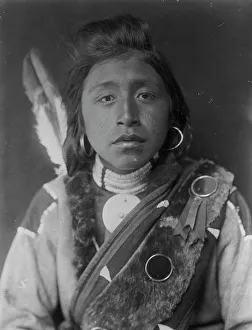 Kashhila-Wishham. Male Chinookan Indian, head-and-shoulders portrait, facing front... c1910. Creator: Edward Sheriff Curtis