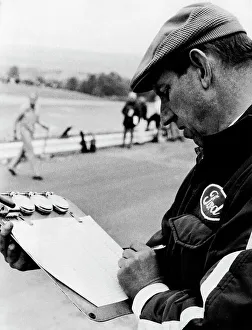 Tyrrell Prints: Ken Tyrrell noting down times, (c1970s?)