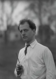 Kennerley Mitchell Prints: Kennerley, Mitchell, Mr. standing outdoors, 1914 or 1915. Creator: Arnold Genthe