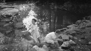 Kennerley Mitchell Prints: Kennerley, Richard and Morley, playing by a pond, 1912 or 1913. Creator: Arnold Genthe
