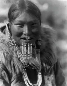 Nose Piercing Prints: Kenowun-Nunivak, c1929. Creator: Edward Sheriff Curtis