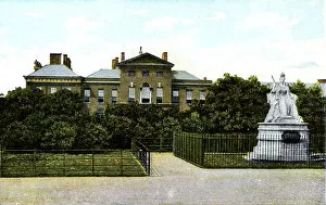 London Landmarks Collection: Kensington Palace and Queen Victorias Statue, London, 20th Century