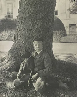 Kermit Roosevelt and his dog Jack, 1902. Creator: Frances Benjamin Johnston