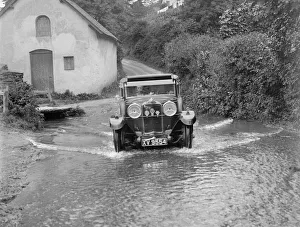 Kitty Prints: Kitty Brunell fording the River Exe in a Talbot 14 / 45 sportsmans coupe, Winsfors