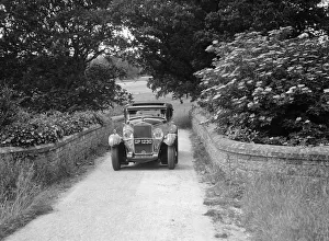 Kitty Brunell road testing a 1931 Delage D8. Artist: Bill Brunell