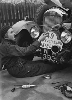 Car Maintenance Gallery: Kitty Brunell working on her Singer Junior, Monte Carlo Rally, 1928. Artist: Bill Brunell