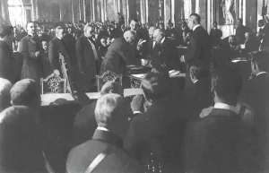 Diplomatic Prints: La signature du traite de paix a Versailles; M Clemenceau signe debout: derriere