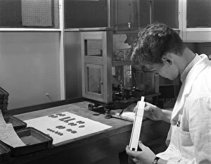 Artificer Gallery: Lab technician with a slide rule, Edgar Allens steel foundry, Sheffield, South Yorkshire, 1962