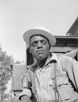 Laborer listening to instructions being given by a section foreman, Washington, D. C, 1942. Creator: Gordon Parks