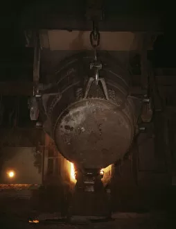 Ladle of molten iron is poured into... Allegheny Ludlum Steele Corp. Brackenridge, Pa. (1941?)