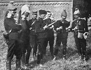 L'aide Francaise a la Belgique; A l'ecart, l'etat-major de la brigade etudie la carte, 1914. Creator: Unknown