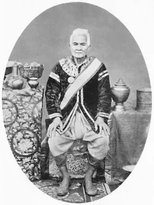 Laos Prints: A Lao chief, 77 years old, In Siamese uniform, 1902. Artist: James McCarthy