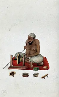 Cross Legged Prints: A lapidary at work cutting and polishing stones