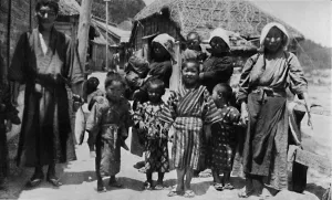 Large family of young fisherman at Nabuto, with nine children, c1900, (1921). Artist: Julian Leonard Street