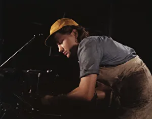 Gender Gallery: A lathe operator machining parts for...Consolidated Aircraft Corp. plant, Fort Worth, Texas, 1942
