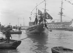 Yacht Race Prints: After launch of Shamrock IV at Gosport with H. M. S. Victory in the background, May 1914
