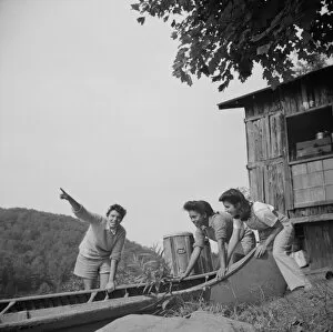 Launching a canoe at Camp Gaylord White, Arden, New York, 1943. Creator: Gordon Parks