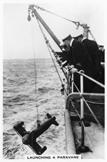 Images Dated 7th July 2007: Launching a paravane from the battleship HMS Rodney, 1937