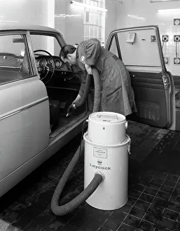 Motor Maintenance Gallery: Laycock Vacacar vacuum cleaner in use at an Esso garage, Sheffield, South Yorkshire, 1965
