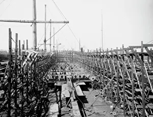 Prop Prints: Laying keel of no. 400, Globe Iron Works, Cleveland, Ohio, ca 1900. Creator: Unknown