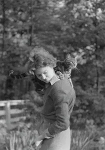 Producer Prints: Le Gallienne, Eva, with cat, outdoors, 1937 Creator: Arnold Genthe