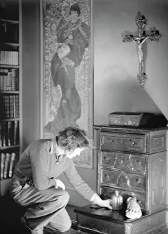 Arranging Prints: Le Gallienne, Eva, portrait photograph, 1937 Creator: Arnold Genthe