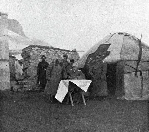 Le general Kalitine, commandant d'un des corps d'armee, suit sur la carte le rapport d'un... 1916. Creator: Unknown