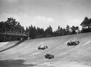 Lea-Francis 1496 cc, MG M type and Invicta 4467 cc racing on the Members Banking at Brooklands