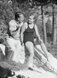 Group Portraits Prints: Lee, Margaret, Miss, and unidentified man, seated outdoors, 1927 Creator: Arnold Genthe