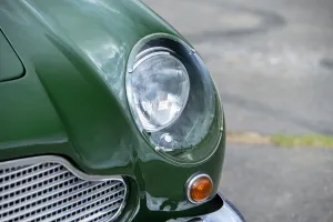 Sports Car Prints: Left front headlight of a 1961 Aston Martin DB4 GT previously owned by Donald Campbell
