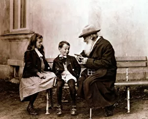 Leo Tolstoy, Russian writer, philosopher and mystic, telling his grandchildren a story, c1890-1910