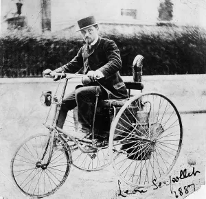Leon Serpollet on his first steam tricycle, 1887